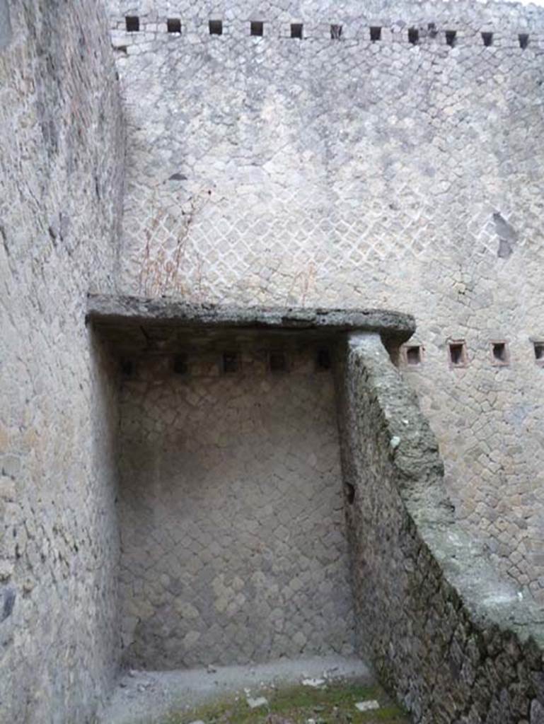 Ins. Orientalis II.6, Herculaneum. September 2015.
Looking east across rear room, with remains of mezzanine floor, and holes for support beams for an upper floor.